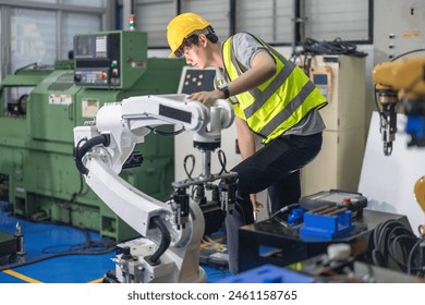 Robotic trainees learn operating, programming, troubleshooting, and quality control through practical workshops and demonstrations of robotic arms and systems in the manufacturing training academy. - Powered by Shutterstock