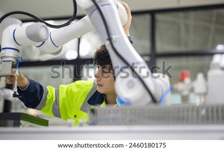 Robotic trainees learn operating, programming, troubleshooting, and quality control through practical workshops and demonstrations of robotic arms and systems in the manufacturing training academy.