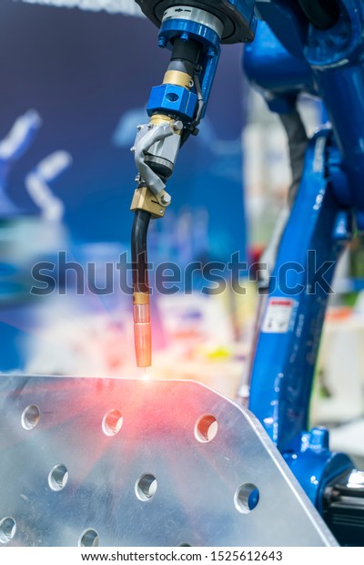 Robotic\
Welding Machine in a Metal Manufacturing\
Plant