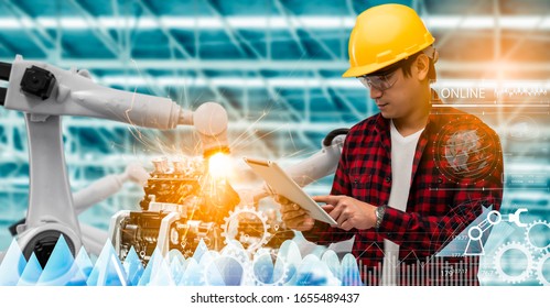 Robotics or digital intelligent manufacturing operation concept.Manager engineer control and check automation robot machine in intelligent factory.Supervisor management on real time monitoring system. - Powered by Shutterstock