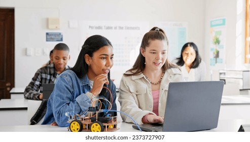 Robotics, education and children with laptop at school learning coding, robot or car toy. Girl students in classroom for technology, electronics or science for development, innovation or teamwork - Powered by Shutterstock