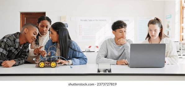 Robotics, education and student group at school learning future coding, programming or laptop. Children in a class for tech, electronics or science discussion as development, innovation or teamwork