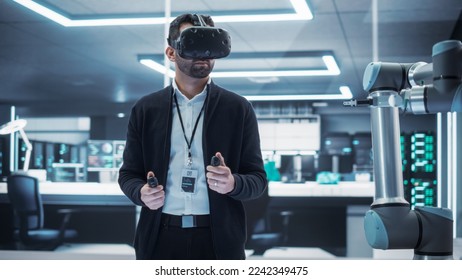 Robotics Engineer Operating a Futuristic Robotic Arm, Using a Virtual Reality Headset and Controllers to Perform Tasks. Work in Research and Development High Tech Facility Startup. - Powered by Shutterstock