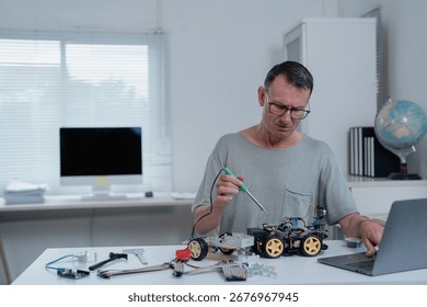 Robotics engineer soldering electronic components for a robot car while focusing on a laptop in a bright, modern office, showcasing skills in technology and innovation - Powered by Shutterstock - Get 15% off with code: PIKWIZARD15