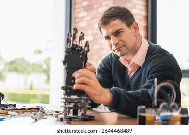 Robotics Engineer Working on Advanced Prosthetic Arm, Man Assembles Bionic Hand Prototype, Scientist Developing Robotic Limb, Innovation in Progress