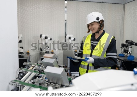 Robotics manufacturing industry. Engineer control and training autonomous robot. Test programmable logic controller with AI robot training kit and mechatronics engineering