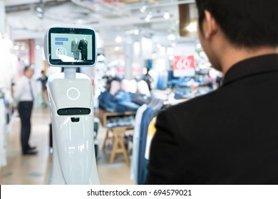 Robotics Trends Technology , Smart Retail Business Concept. Autonomous Personal Assistant Robot For Navigation Customer To Search Items In Fashion Shopping Mall.