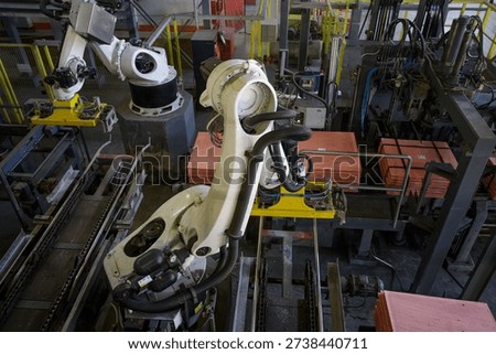 Robots for stripping pure copper from cathode. Workshop of electrolysis in copper foundry.