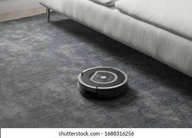 Robots Vacuums Cleaners On Carpet In Living Room For Cleaning Pet Hair And Dust.