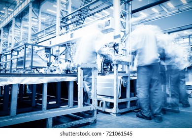 robots welding in a car factory - Shutterstock ID 721061545