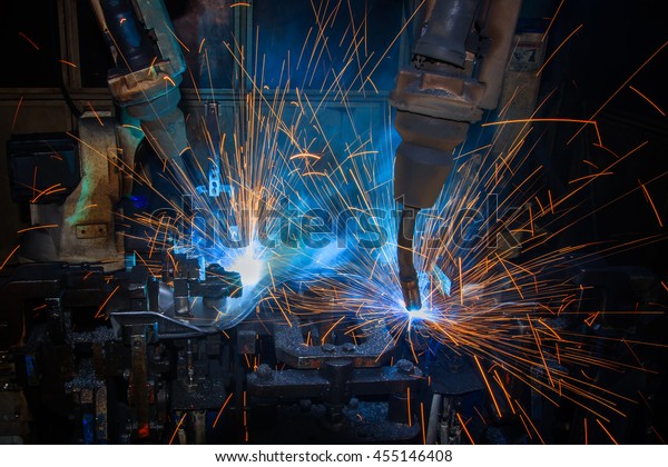 robots are welding in\
factory