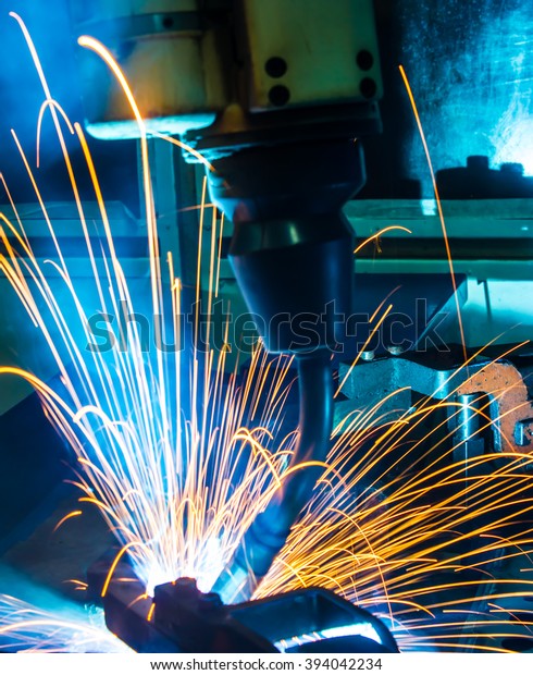 Robots welding movement\
in a car factory