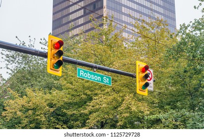 Robson Street Sign In The Center Of Vancouver, Canada.