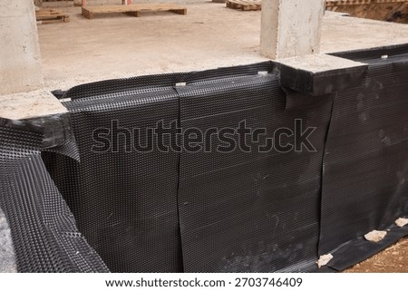 Robust waterproof membrane with drainage and protective features for construction, Heavy-duty moisture barrier with dimpled sheeting and drainage system for building