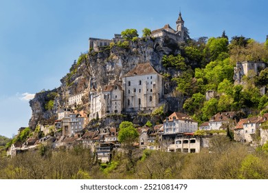 Rocamadour is a vertical village built in a series of stages on the clifftop above Alzou canyon. Lot, Occitanie region, Perigord, France. Rocamadour was first and foremost a pilgrimage hotspot.