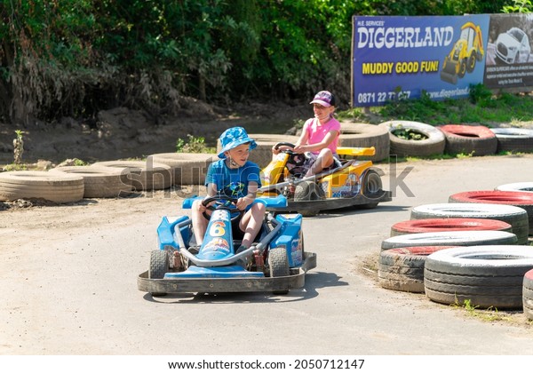 Rochester, Kent, UK - June 02, 2021:\
Diggerland Kent Theme Park. Children enjoying\
go-karts.