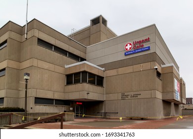 Rochester, NY, USA - March 3, 2020: Urgent Care And Red Cross Sign On The Building Of Anthony L. Jordan Health Center (AJHC) In Rochester, NY, USA. AJHC Is A Community Clinic. 