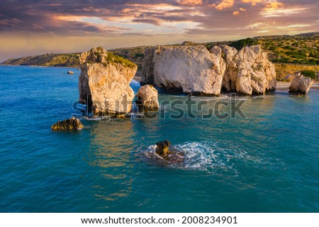 Rock of Aphrodite in Paphos. Nature of Cyprus. Stone of Aphrodite off coast of Paphos. Mediterranean sea coast landscape. Cliffs of Cyprus at sunset. Travel to Cyprus. Mediterranean cruise.