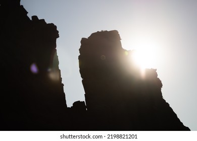 Rock In Backlight In Corsica, On The Famous Gr20 Hiking Path. The Sun Flare Immerses The Spectator In The Picture