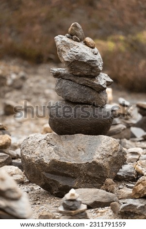 Rock balancing, Stone stacking, pebbles piled in balanced stacks precariously