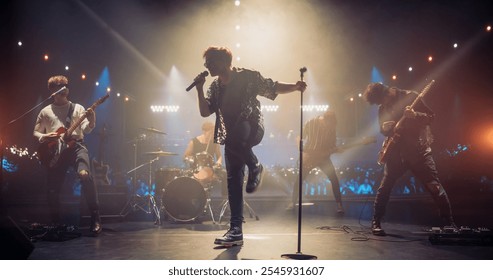 Rock Band Delivers a Captivating Concert with Lead Singer Passionately Performing on Stage with Falling Confetti, Surrounded by Band Members, Creating an Intense and Immersive Musical Atmosphere - Powered by Shutterstock