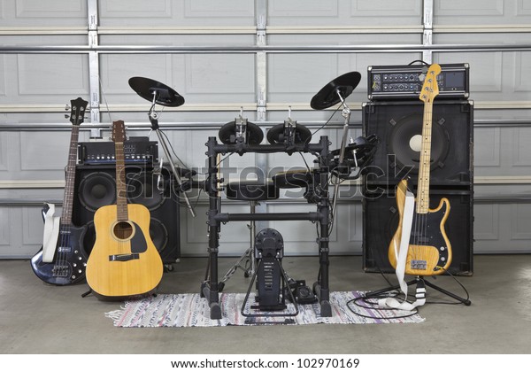 Rock band equipment\
in a suburban garage.