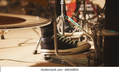 Rock Band Rehearsing In The Garage - Drummer's Foot Wears Sneakers Moving Drum Bass Pedal