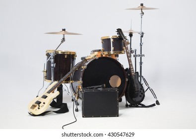 Rock Band, Solo Guitar, Bass, Drums, Microphone On A Black Suitcase.