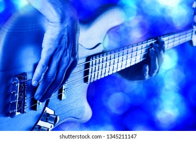 Rock Bassist Hands Playing Electric Bass Guitar Live On Stage