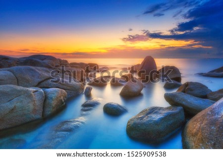 Rock beach in sunset , Larn Hin Kaw Hadmarrumphung , Rayong Thailand