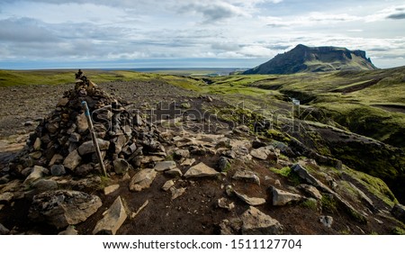 Rock cairn and scenic landscape view hiking highlands of Iceland
