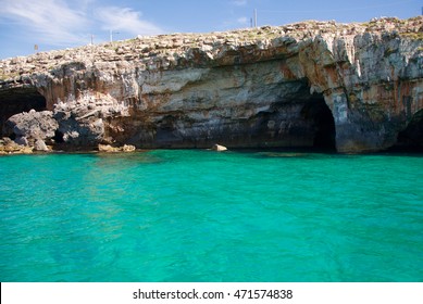 Rock Caves And Cristal Water Coastline Landscape In Salento, Apulia, Italy