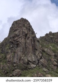rock cliif and clouds in sky