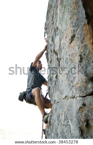 Similar – Rock climber clinging to a cliff.