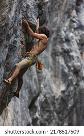 rock climber climbs the rock. a strong man overcomes a difficult route. relaxation and freedom in nature. - Shutterstock ID 2178517509