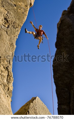 Similar – Climber reaching for a helping-hand.