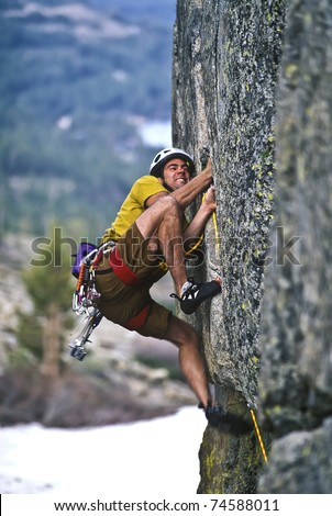 Similar – Rock climber clinging to a cliff.