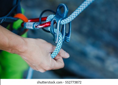 Rock Climber Wearing Safety Harness And Climbing Equipment Outdoor, Close-up Image