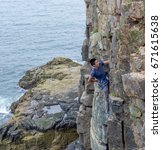 Rock climbing sea cliffs at Acadia National Park