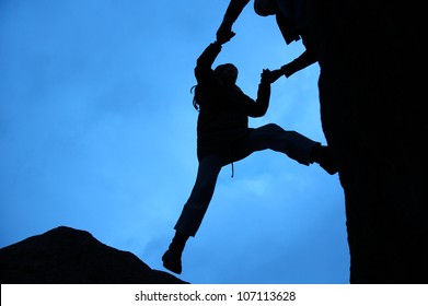 Rock Climbing Silhouette, Gets A Helping Hand To Get Up