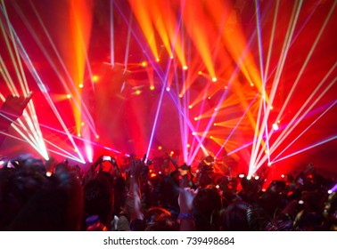 Rock Concert Background, Large Group Of People Enjoying Party, Having Fun In Night Club In Bright Red Laser Light, Active Night Life, Music Star Performance