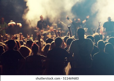 Rock Concert, Cheering Crowd In Front Of Bright Colorful Stage Lights