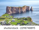 Percé rock from a distance, small town of Percé at the edge, Gaspesie, QC, Canada