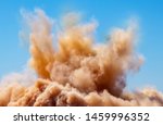 Rock dust clouds during detonator blasting on the mining site 