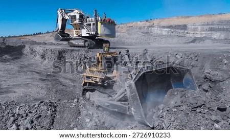 Rock extraction process and massive earthmoving in an open-pit mine