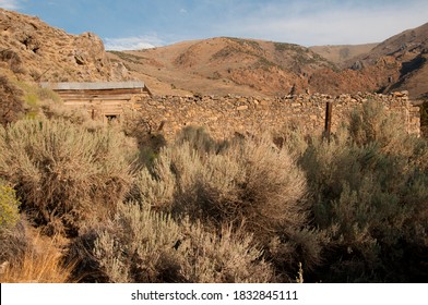 Rock Fence And Building In A Canyon In Northern Nevada With Big Sagebrush.