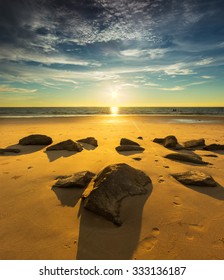 Rock Formation Over The Sunset Sky In Borneo Beach.