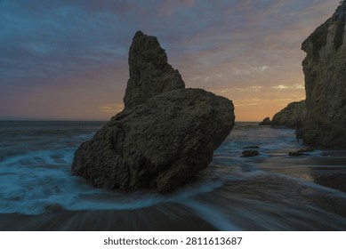 Rock Formation at Sunset on Dramatic Coastal Shoreline