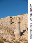 rock formations in an arid landscape with a clear blue sky famous place in atocha bolivia
