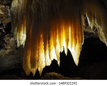 Rock Formations At Black Chasm Cavern In Northern California. Stalactites, Stalagmites And Columns Are Illuminated By The Park Lighting System.